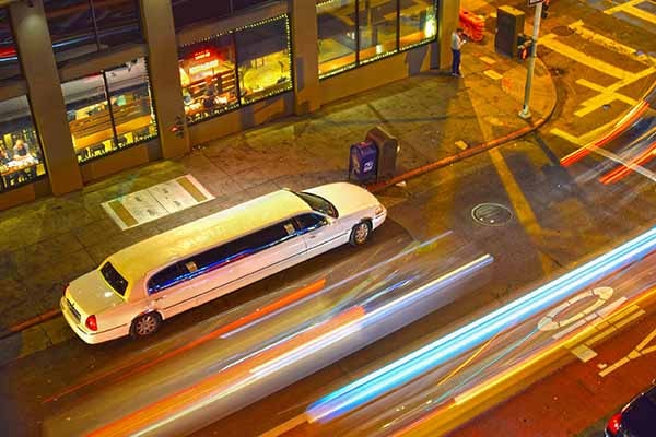 Neon Limo and Party Bus Rental at night